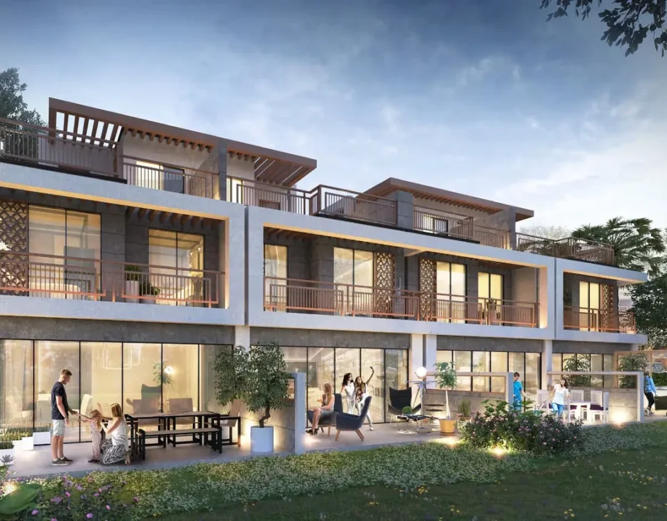 Modern multi-story luxury residential building in Damac Hills 2 project; featuring spacious balconies, glass-fronted apartments, and lush garden area.